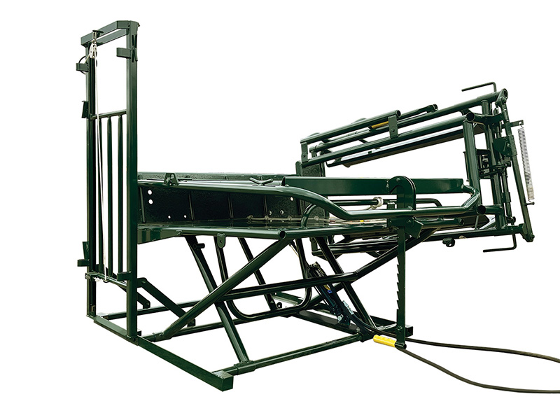 The Calf Tipping Table has an attached overhead access gate that pins to the Hi-Hog Calf Alley a table for the treatment of calves and small animals
